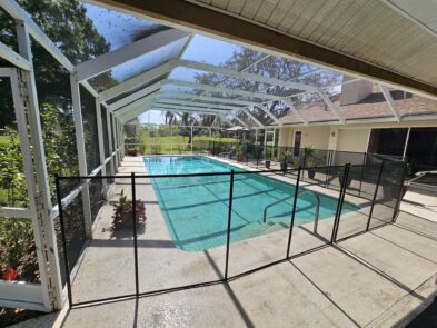 a swimming pool with a covered patio
